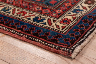 Antique Persian Bidjar Runner, Circa 1900. Showcases a dramatic chain of geometric lozenge medallions woven across a deep midnight blue field framed by richly detailed terracotta borders.

3'7" x 15'0"

Item No: 74360  