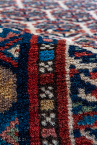 Antique Persian Bidjar Runner, Circa 1910. Rare allover Herati lattice woven across a warm ivory field framed by richly detailed terracotta and midnight blue borders.
2'9" x 15'9"
Item No: C90548