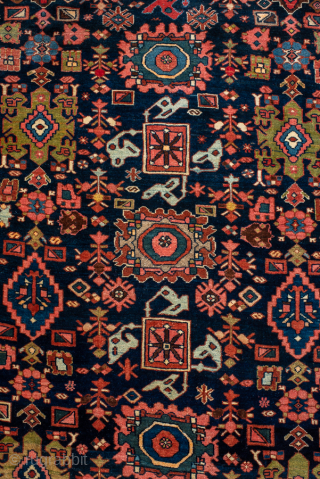 Antique Persian Bidjar Rug, Circa 1910. Detailed allover lattice of geometric floral motifs woven across a deep midnight blue field framed by an elegant rose-red floral border.

4'6" x 6'9"

Item No: 95419  