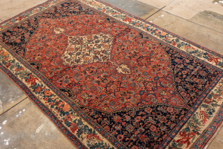 Antique Persian Bidjar Rug, Circa 1900. Finely drawn ivory diamond medallion set within a richly patterned terracotta field framed by an elegant ivory floral border.
4'9" x 8'1"
Item No: 98992