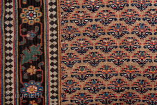 Antique Persian Bidjar Rug, Circa 1910. Rare allover Mina Khani-inspired lattice of stylized floral motifs woven across a warm ivory field framed by a striking midnight blue floral border.
4'1" x 9'0"
Item No: ...