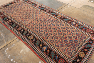 Antique Persian Bidjar Rug, Circa 1910. Rare allover Mina Khani-inspired lattice of stylized floral motifs woven across a warm ivory field framed by a striking midnight blue floral border.
4'1" x 9'0"
Item No: ...