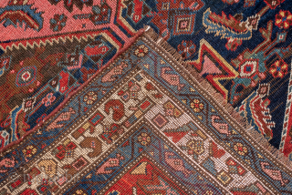 Antique Persian Bidjar Runner, Circa 1910. Bold series of geometric medallions woven across a deep midnight blue field framed by an elegant ivory floral border. 

3'4" x 10'10"

Item No: 99068   