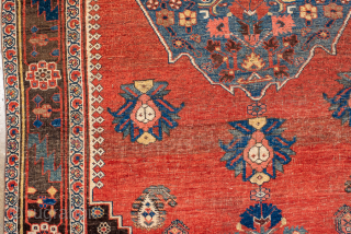 Antique Persian Bidjar Rug, Circa 1900. Bold indigo diamond medallion set against a warm salmon-red field adorned with stylized floral and geometric motifs.
4'8" x 9'7"
Item No: 99453
