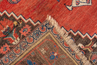 Antique Persian Bidjar Rug, Circa 1900. Bold indigo diamond medallion set against a warm salmon-red field adorned with stylized floral and geometric motifs.
4'8" x 9'7"
Item No: 99453