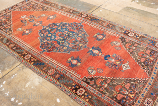 Antique Persian Bidjar Rug, Circa 1900. Bold indigo diamond medallion set against a warm salmon-red field adorned with stylized floral and geometric motifs.
4'8" x 9'7"
Item No: 99453
