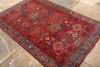 Antique Persian Bidjar Carpet, Circa 1910. Vibrant allover Herati pattern woven across a rich terracotta field framed by an eye-catching sky-blue floral border.
4'5" x 6'8"
Item No: 99576