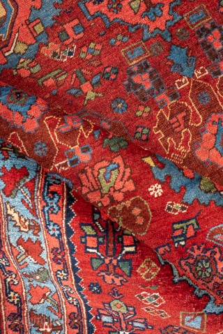 Antique Persian Bidjar Carpet, Circa 1910. Vibrant allover Herati pattern woven across a rich terracotta field framed by an eye-catching sky-blue floral border.
4'5" x 6'8"
Item No: 99576