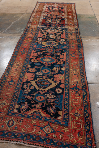 Antique Persian Bidjar Runner, Circa 1910. Elegant vertical arrangement of stylized palmettes and Herati-inspired floral motifs woven across a rich midnight blue field framed by finely detailed terracotta borders.
3'7" x 13'0"
Item No: ...