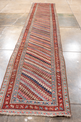Antique Persian Bidjar Runner, Circa 1910. Rare allover diagonal striped design filled with finely woven geometric motifs in warm terracotta, ivory, and indigo.
3'2" x 16'6"
Item No: 99888