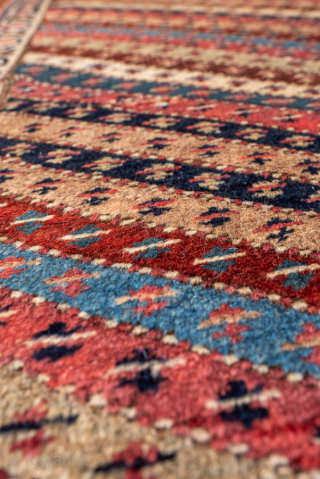 Antique Persian Bidjar Runner, Circa 1910. Rare allover diagonal striped design filled with finely woven geometric motifs in warm terracotta, ivory, and indigo.
3'2" x 16'6"
Item No: 99888