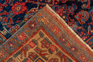 Antique Persian Bidjar Runner, Circa 1910. Finely woven allover Herati design across a rich midnight blue field framed by an elegant golden camel floral border.
3'8" x 10'4"
Item No: C93878