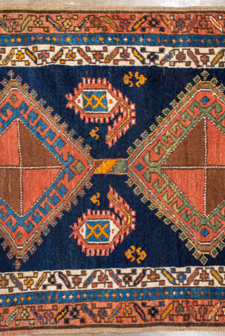 Antique Persian Kurdish Runner, Circa 1900. Bold diamond medallions set against a striking deep-indigo field.

3'4" x 11'4"

Item No: 100979              