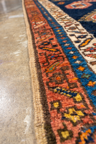 Antique Persian Kurdish Runner, Circa 1900. Bold diamond medallions set against a striking deep-indigo field.

3'4" x 11'4"

Item No: 100979              