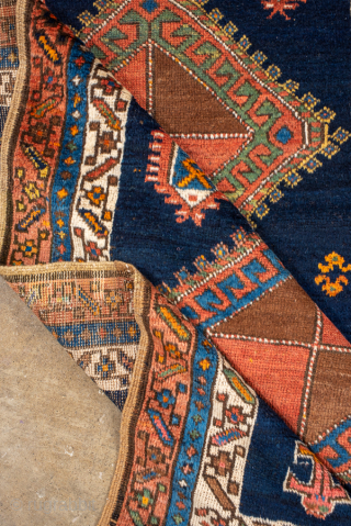 Antique Persian Kurdish Runner, Circa 1900. Bold diamond medallions set against a striking deep-indigo field.

3'4" x 11'4"

Item No: 100979              