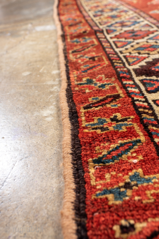 Antique Persian Kurdish Runner, Circa 1900. Features a striking sequence of geometric medallions on a rich madder-red field.
3'5" x 9'7"
Item No: 101344