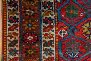Antique Persian Kurdish Rug, Circa 1900. Finely woven allover lattice of hooked diamond medallions across a vibrant madder-red field framed by elegant ivory and geometric tribal borders.
4'8" x 8'8"
Item No: 41320