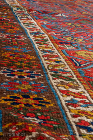 Antique Persian Kurdish Rug, Circa 1900. Finely woven allover lattice of hooked diamond medallions across a vibrant madder-red field framed by elegant ivory and geometric tribal borders.
4'8" x 8'8"
Item No: 41320