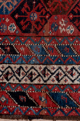 Antique Persian Kurdish Rug, Circa 1900. Finely detailed allover lattice of octagonal tribal motifs woven across a rich midnight blue field framed by crisp ivory geometric borders.
4'0" x 8'7"
Item No: C68492