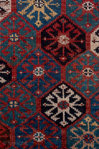 Antique Persian Kurdish Rug, Circa 1900. Finely detailed allover lattice of octagonal tribal motifs woven across a rich midnight blue field framed by crisp ivory geometric borders.
4'0" x 8'7"
Item No: C68492