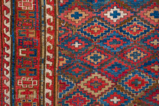 Antique Persian Kurdish Rug, Circa 1900. Vibrant allover lattice of hooked diamond motifs woven across a luminous sky-blue field framed by bold madder-red tribal borders.
4'3" x 8'4"
Item No: 85595