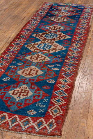 Antique Persian Kurdish Rug, Circa 1900. Dramatic series of hooked hexagonal medallions woven across a brilliant sapphire-blue field framed by vibrant serrated tribal borders.
2'9" x 8'8"
Item No: C93657