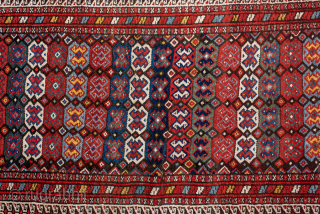 Antique Persian Kurdish Runner, Circa 1900. Dense allover arrangement of small geometric motifs organized in rhythmic horizontal rows.
3'7" x 12'0"
Item No: 99091