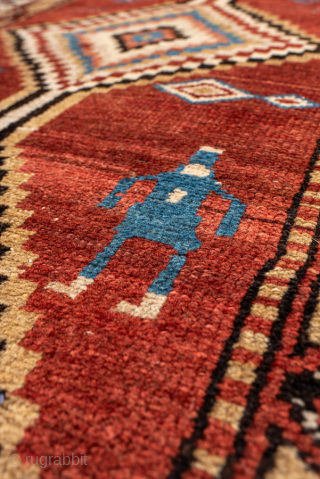 Antique Persian Kurdish Rug, Circa 1900. Striking stepped diamond medallions woven across a warm madder-red field accented by charming tribal figures and symbolic geometric motifs.
4'0" x 8'8"
Item No: 99969