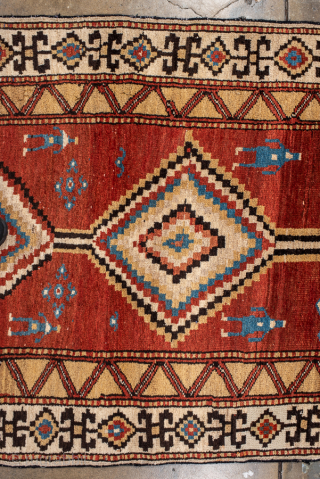 Antique Persian Kurdish Rug, Circa 1900. Striking stepped diamond medallions woven across a warm madder-red field accented by charming tribal figures and symbolic geometric motifs.
4'0" x 8'8"
Item No: 99969