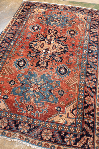 Antique Persian Heriz Rug with Geometric Medallion, Circa 1910. Bold geometric medallion surrounded by angular floral motifs on a warm madder-red field.

4'0" x 6'4"

Item No: 102014       