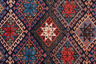 Antique Persian Kurdish Runner with Diamond Lattice Design, Circa 1900. Features an interlocking diamond lattice filled with colorful geometric floral motifs.
3'10" x 15'0"
Item No: 99056