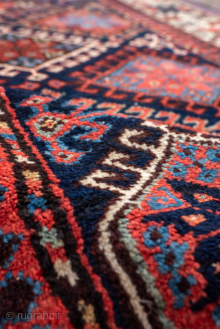 Antique Persian Kurdish Runner with Diamond Lattice Design, Circa 1900. Features an interlocking diamond lattice filled with colorful geometric floral motifs.
3'10" x 15'0"
Item No: 99056