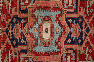 Antique Persian Serapi Rug with Geometric Medallion, Circa 1900. Bold geometric medallion surrounded by angular floral motifs on a warm rust-red field.
5'0" x 6'3"
Item No: 101962