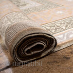 This elegant antique Oushak rug showcases a beautifully detailed allover lattice design in soft sage green and ivory, framed by a wide border in warm peach and golden tones. Its geometric patterning  ...