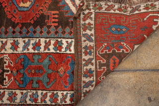 Antique Caucasian Kazak Runner with Geometric Medallions, Circa 1910. A succession of colorful geometric medallions across a dark field, surrounded by bold tribal borders.
3'6" x 13'6"
Item No: 102236