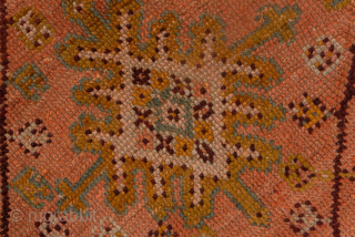This antique Turkish Oushak rug, woven circa 1900, showcases a beautifully understated lattice and medallion design on a rich rust field framed by a wide gold border with delicate floral detailing. The  ...