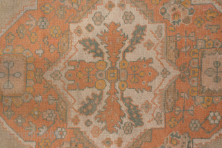 This impressive antique Oushak rug, measuring 13.5 x 17.0 feet, showcases the grandeur and artistry of late 19th to early 20th century Anatolian weaving. The rug features a bold central medallion set  ...