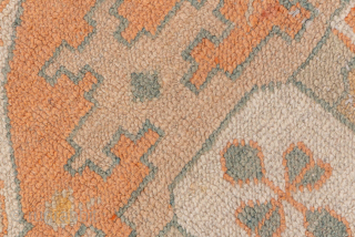 This exceptional antique Oushak rug, woven circa 1900, is a magnificent example of large-scale Anatolian weaving. Measuring over 13 × 16 feet, it features a grand central medallion design flanked by smaller  ...