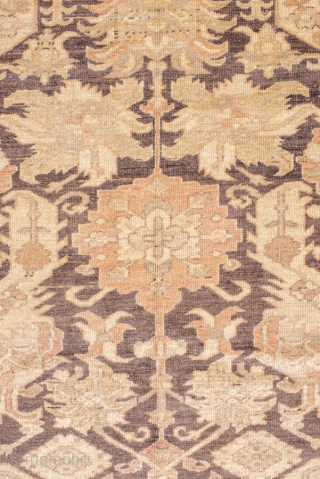 This magnificent antique Oushak rug showcases a highly decorative repeating lattice motif, executed in a refined palette of soft taupe, ivory, muted rose, and charcoal accents. The allover design conveys symmetry and  ...