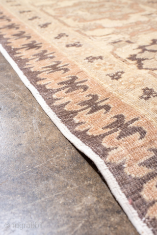 This magnificent antique Oushak rug showcases a highly decorative repeating lattice motif, executed in a refined palette of soft taupe, ivory, muted rose, and charcoal accents. The allover design conveys symmetry and  ...