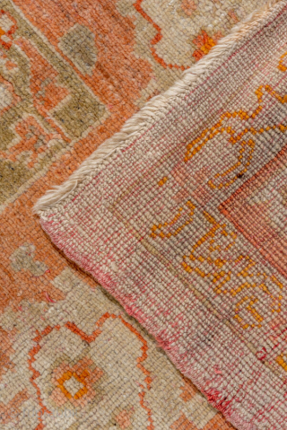 This magnificent antique Oushak rug, woven circa 1900, showcases the timeless elegance for which Oushak weaving is celebrated. The expansive 13 × 15 ft scale makes it a commanding centerpiece, perfect for  ...