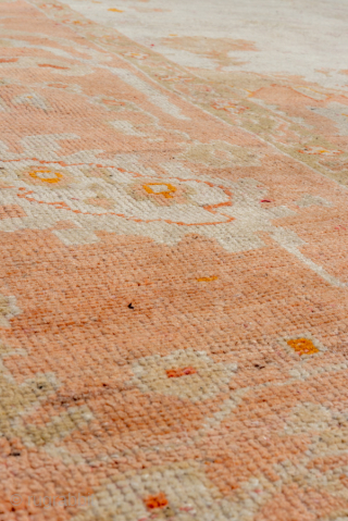 This magnificent antique Oushak rug, woven circa 1900, showcases the timeless elegance for which Oushak weaving is celebrated. The expansive 13 × 15 ft scale makes it a commanding centerpiece, perfect for  ...