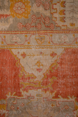 This grand-scale antique Oushak rug from Western Turkey showcases the effortless elegance and luminous color palette for which Oushaks are celebrated. The spacious field features a striking medallion rendered in shades of  ...