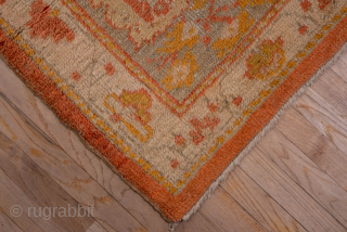 This grand-scale antique Oushak rug from Western Turkey showcases the effortless elegance and luminous color palette for which Oushaks are celebrated. The spacious field features a striking medallion rendered in shades of  ...