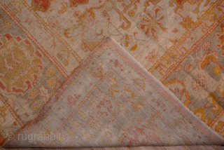 This grand-scale antique Oushak rug from Western Turkey showcases the effortless elegance and luminous color palette for which Oushaks are celebrated. The spacious field features a striking medallion rendered in shades of  ...