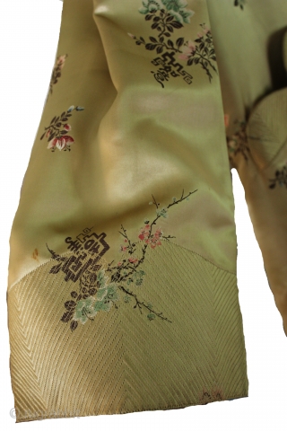Absolutely breathtaking 19th century, silk couture Japanese kimono robe! Features the finest of gold silk, with a beautiful colorful flowers embroidered throughout. Hand sewn intricate stitching details on the bodice, sleeve cuffs,  ...