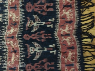 Sumba Ikat Woven fabric with red, black and tan natural dyes. Large
Indonesia, Constructed of 2 long vertical pieces of fabric sewn together in the center, you can see the hand sewn stitch  ...