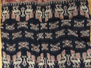 Sumba Ikat Woven fabric with red, black and tan natural dyes. Large
Indonesia, Constructed of 2 long vertical pieces of fabric sewn together in the center, you can see the hand sewn stitch  ...