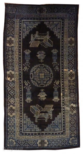 Chinese Antique Blue Baotao Rug
circa 1900
1,62 x 0,85m
The carpet is depecting the eight Buddhist Emblems of Happy Augury.
               