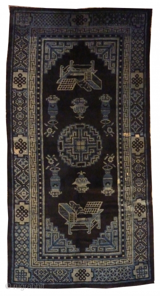 Chinese Antique Blue Baotao Rug
circa 1900
1,62 x 0,85m
The carpet is depecting the eight Buddhist Emblems of Happy Augury.
               